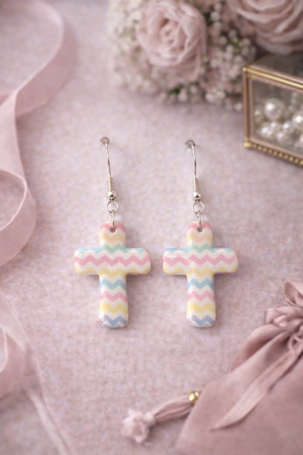 Sweet, soft pastels meet timeless faith with these Pastel Chevron Cross Earrings