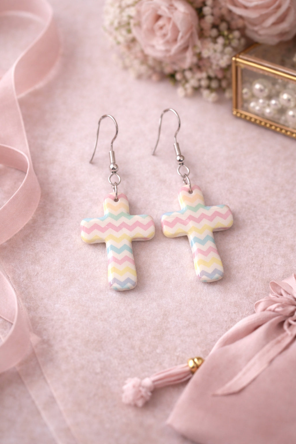 Sweet, soft pastels meet timeless faith with these Pastel Chevron Cross Earrings